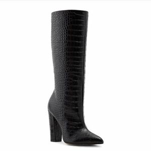 Black knee high boots crocodile pattern.